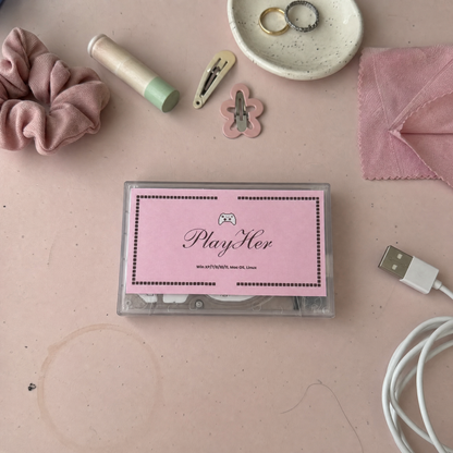 PlayHer console on a pink desk